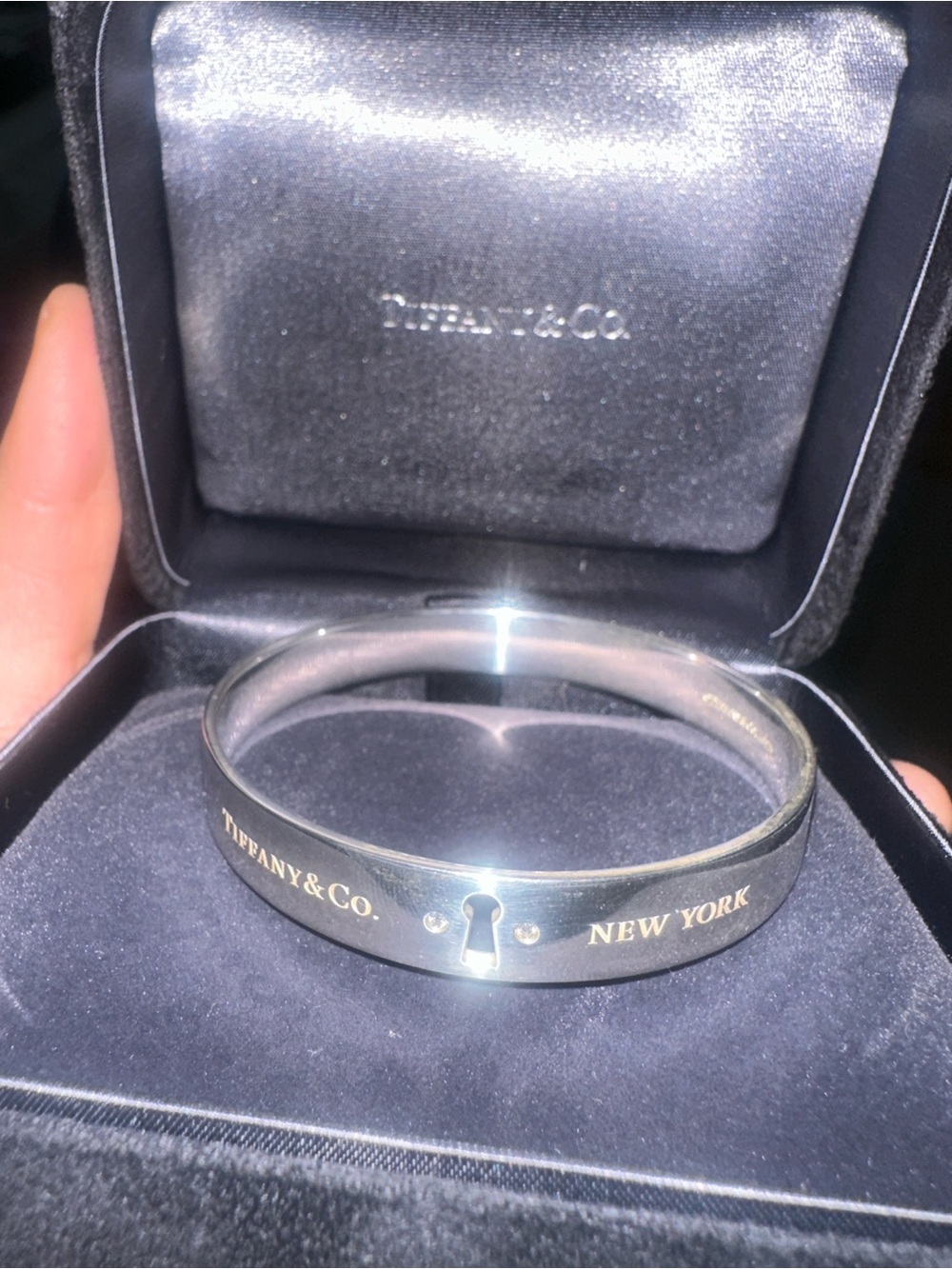Tiffany & Co. Silver Keyhole Bangle with Gold Lettering